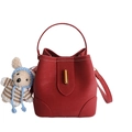 Red pebbled leather bucket bag with top handle, gold twist lock and plush bear charm - With Charm / Red