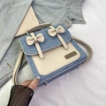 Kleiner Rucksack aus Denim und cremefarbenem Leder mit Schleifen und Logo-Plakette - Hellblau