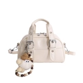 Chic cream white leather shoulder bag with plush doll charm and metallic buckles - With Pendant / White