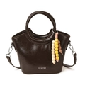 Dark brown glossy bucket bag with beaded charm and adjustable strap for women - Brown