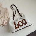 Minimalist beige canvas tote bag with brown leather straps and artistic LOO print - Canvas Brown