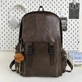 Dark brown retro backpack in faux leather with adjustable buckle straps and plush charm - With Pendant / Brown