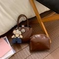Detail of vintage brown leather handbag set with round silver buckle and teddy charm - With Pendant / Brown