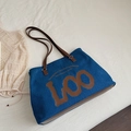 Dark blue denim tote bag with brown leather handles and vintage letter print design - Tan Denim Style