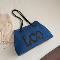 Blue denim tote bag with long black leather handles and LOO artistic lettering - Denim Black