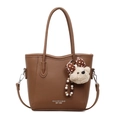 Brown lychee grain bucket bag with slim handles and a white plush bear charm - Brown