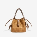 Retro brown embossed bucket bag with floral patterns and leather woven handle - Brown
