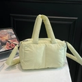 Quilted puffer tote bag in soft pale yellow finish with padded shoulder strap - Light Green