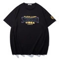 T-shirt nera oversize in cotone con stampa riflettente e logo dorato sulla manica - XL / Nero