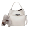 White pebbled leather bucket bag with silver lock and grey plush bunny charm - With Pendant / Off White