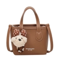 Brown litchi grain bucket bag with brand logo and cute plush bear charm accessory - Brown