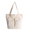 Versatile off-white canvas tote bag featuring double front pockets and silver metal buttons - White