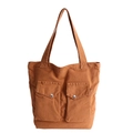 Versatile brown canvas tote bag with two front pockets and metallic snap buttons - Brown