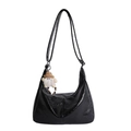 Black crescent tote bag in wrinkled PU leather with a cute white plush monster charm - With Charm / Black
