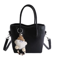 Versatile black bucket bag with dual handles and a cute plush doll charm accessory - With Charm / Black