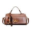 Brown vintage faux leather handbag with wooden bead charm and metal twist lock - With Pendant / Brown
