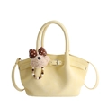 Pale yellow soft leather bucket bag with cute bear charm and thin shoulder strap - With Charm / Yellow