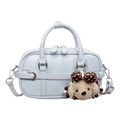 Elegant light blue crossbody bag with small dog charm and textured leather finish - With Pendant / Blue
