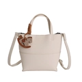 Beige lychee pattern bucket bag with wood rocking horse charm and adjustable strap - White