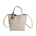 Beige lychee pattern leather bucket bag with top handle and rocking horse charm - Light Grey