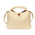 Chic beige lychee leather bucket bag with unique U-handle and copper turn-lock - Off White
