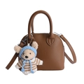 Brown lychee leather shell handbag with cute teddy bear charm and adjustable strap - Brown