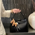 Mini sac seau noir en cuir avec fermoir rotatif argenté et pendentif cheval - Avec Pendentif / Noir