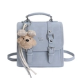 Greyish blue minimalist leather backpack with flap buckle and cute brown bear charm - Blue