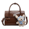 Vintage brown leather crossbody handbag with silver clasp and cute teddy bear charm - Brown
