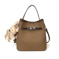 Brown lychee texture bucket bag with silver twist lock and plush bear keychain - With Pendant / Gray