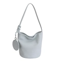 Minimalist light blue bucket bag in lychee leather with shoulder strap and coin purse - Blue