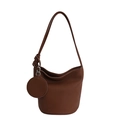 Minimalist dark brown litchi pattern leather bucket bag with shoulder strap and charm - Brown