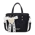 Black leather handbag featuring a white lace bow with a pearl heart and crossbody strap - With Pendant / Black