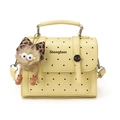 Chic cream polka dot handbag with a cute plush monster charm and thin shoulder strap - With Pendant / Yellow