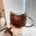 Brown quilted rhombus chain bucket bag with vintage gold metal hardware and flap - Brown