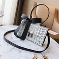 Chic black and white tweed crossbody bag with a large bow and silver metal buckle - White