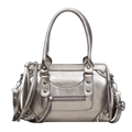 Metallic silver Boston pillow bag featuring biker rivets and fringe tassel details - Champagne
