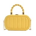 Detail of yellow box bag featuring vertical stripe texture and woven top handle - Yellow