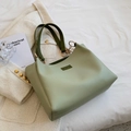 Light green faux leather tote bag with dark green handles for daily office commute - Green