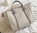 Large beige woven canvas tote bag with purple leather trim and metal chain straps - M / Purple