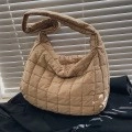 Brown quilted puffer shoulder bag featuring a padded square grid texture and wide strap - Khaki