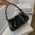 Fashionable black pleated cloud bag with adjustable shoulder strap in matte leather finish - Black