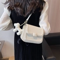 Minimalist white crossbody bag with square buckle and cute balloon dog charm on side - White With Pendant