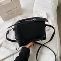 Chic black box crossbody bag with silver studs on a clean minimalist white background - Black