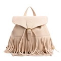 Beige faux leather backpack featuring bohemian tassel fringe and classic flap closure - White