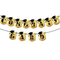 Detailed view of Congrats Grad banners with graduation cap icons and party decorations - Gold Banner