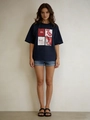 Detail of navy blue oversized t-shirt featuring retro mon cheri print and denim shorts - S / Navy Blue