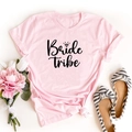 Pink cotton Bride Tribe T-shirt with diamond ring print flat lay on white background - S / Pink