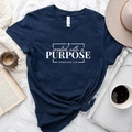 Flat lay of navy cotton T-shirt with Created with a Purpose text and casual accessories - Navy Blue