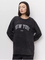 Detail of vintage acid wash texture and white New York USA print on long sleeve cotton tee - M / Washed Black